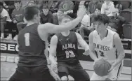  ?? Graham Thomas/Siloam Sunday ?? Siloam Springs senior Murphy Perkins, right, drives into the lane as Alma’s Tanner Shelton, left, and Cejay Mann defend on the play Tuesday at Panther Activity Center. The Airedales defeated the Panthers 71-67.