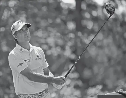  ??  ?? Kevin Kisner watches his tee shot on the fifth hole during the first round of the BMW Championsh­ip last Thursday at Caves Valley Golf Club. NICK WASS/AP