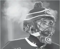  ?? CP PHOTO/TOM HANSON ?? Steam rises from Montreal Canadiens goaltender José Théodore during the chilly 2003 Heritage Classic in Edmonton.