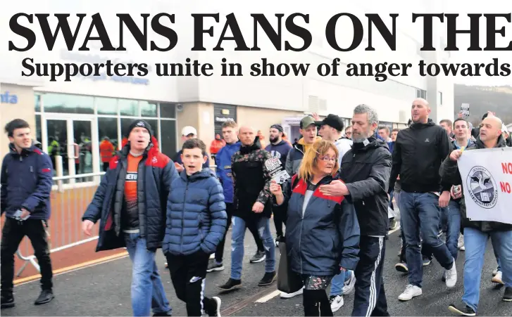  ??  ?? Above and below: Swansea City fans’ during the protest march against the club’s American owners