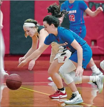  ?? SARAH GORDON/THE DAY ?? Fitch’s Rita Sefransky, left, and Waterford’s Gabby Kramer battle for a loose ball during Tuesday night’s ECC Division II game in Groton. The Falcons won their 10th game of the season with a 45-28 victory over the Lancers. Visit www.theday.com to view a photo gallery.