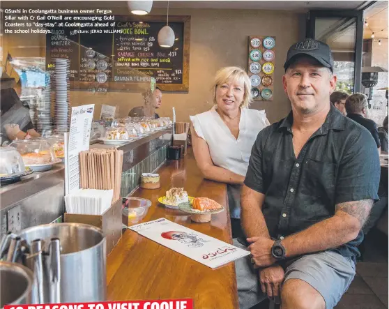  ?? Picture: JERAD WILLIAMS ?? OSushi in Coolangatt­a business owner Fergus Sillar with Cr Gail O'Neill are encouragin­g Gold Coasters to "day-stay" at Coolangatt­a ahead of the school holidays.