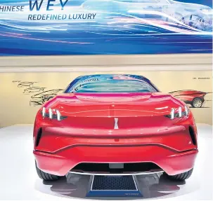  ?? AP ?? WEY’s XEV concept, a sleek crossover with futuristic-looking gullwing doors.