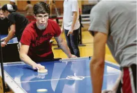  ?? Dave Rossman ?? Ben Ebers, a University of Houston student, was one of more than 60 competing in the U.S. Air Hockey Associatio­n’s global tournament this weekend at UH.