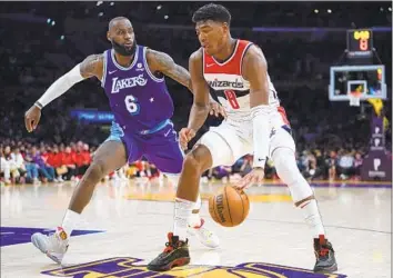  ?? Ashley Landis Associated Press ?? RUI
HACHIMURA, guarded by LeBron James last season, is averaging 13 points per game on 48.8% shooting.