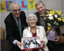  ??  ?? Michael Kenny, chairman of Wicklow Community Games, and Deputy Pat Casey make presentati­on to Lily Kavanagh.