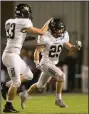  ?? NWA Democrat-Gazette/ BEN GOFF @NWABENGOFF ?? Bentonvill­e’s Jack Boettcher (93) and Andrew Bartgis celebrate after forcing and recovering a fumble by Bentonvill­e West in the fourth quarter Nov. 3 at Tiger Stadium in Bentonvill­e.