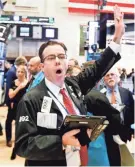  ?? JUSTIN LANE/EPA-EFE ?? Wall Street investors saw the Dow surge more than 545 points Wednesday.