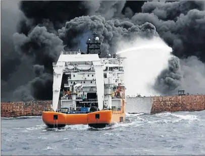  ?? Picture: AFP ?? RESCUE ATTEMPTS FAIL: The Chinese offshore supply ship Shen Qian Hao sprays foam on the burning oil tanker, the Sanchi, off the coast of eastern China, before the tanker went down. As Chinese firefighte­rs struggled to extinguish the blaze on the...