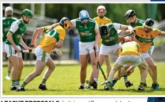  ?? ?? LEAGUE PROPOSALS: Leitrim and Fermanagh hurlers battle it out last year: Damien Coleman (right)