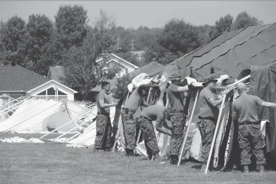  ?? ALAN S. HALE ?? Canadian Forces members from CFB Petawawa erected enough tents Friday to house 500 asylum seekers in addition to the room for 300 inside the Nav Centre in Cornwall.