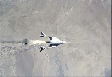  ?? VIRGIN GALACTIC — THE ASSOCIATED PRESS ?? This image provided by Virgin Galactic shows the release of VSS Unity from VMS Eve and ignition of the rocket motor. More than 600 people already have reserved a ride to space. Tickets initially cost $250,000, but the price is expected to go up.