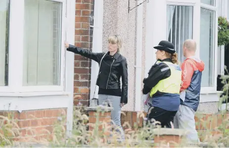  ??  ?? Robert Hutchinson’s daughter Paula Hutchinson and her brother Gavin Newton during yesterday’s leaflet appeal.