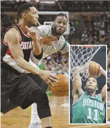  ?? STAFF PHOTO BY JOHN WILCOX/HERALD FILE PHOTO ?? GLAD TO BE BACK: Evan Turner (left), playing at the Garden for the first time since playing for the C’s (inset), dribbles around Jae Crowder during yesterday’s game.