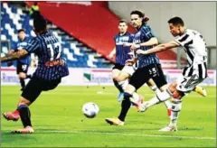  ?? AFP ?? Juventus’ Portuguese forward Cristiano Ronaldo (right) shoots on target during the final of the Italian Cup (Coppa Italia) football match against Atalanta on May 19.