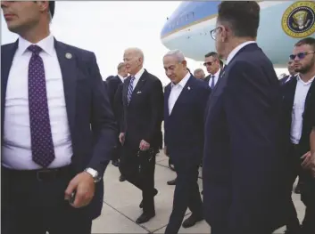  ?? AP PHOTO/EVAN VUCCI ?? President Joe Biden is greeted by Israeli Prime Minister Benjamin Netanyahu after arriving at Ben Gurion Internatio­nal Airport, on Wednesday in Tel Aviv.