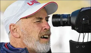  ?? RICK BOWMER/ASSOCIATED PRESS ?? Sean Mccann stares through a spotting scope at the targets 50 meters away during a biathlon event in October at the Soldier Hollow Nordic Center in Midway, Utah. Mccann is a clinical psychologi­st who works for the U.S. Olympic and Paralympic Committee.