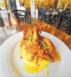 ?? PHOTO BY ANNE BRALY ?? Dinner at Supper, the restaurant at Hotel Emma, features a number of Southwest-style dishes with a twist, such as the smoked fried quail artfully presented on a bed of mashed potatoes with pickled corn relish.