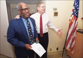  ?? Matthew Brown / Hearst Connecticu­t Media file photo ?? Dudley Williams, Mill River Collaborat­ive director, left, is surprised by Stamford Mayor David Martin and many of his co-workers and friends after learning he had been named as Stamford’s 2017 Citizen of the Year.