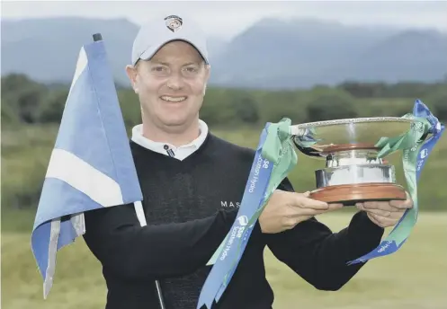  ??  ?? 0 Richard Mcevoy poses with the SSE Scottish Hydro Challenge trophy after his £35,000 four-shot victory at Macdonald Spey Valley.