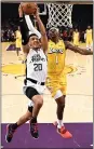  ?? RINGO H.W. CHIU — AP ?? The Clippers’ Landry Shamet goes up for a layup under pressure from the Lakers’ Kentavious Caldwell-Pope.