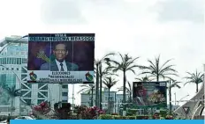  ?? ?? MALABO: A general view of a campaign billboard for Equatorial Guinea President, Teodoro Obiang Nguema Mbasogo in Malabo. —AFP