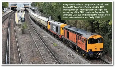  ?? MARK PIKE. ?? Harry Needle Railroad Company 20311 and 20132Barro­w Hill Depot pass Putney with the 0939 Wellingbor­ough-Tonbridge West Yard leg of the second day of the GBRf charter on September 21. GBRf uses Class 20s on its contract to move S-Stock trains between London and Derby.