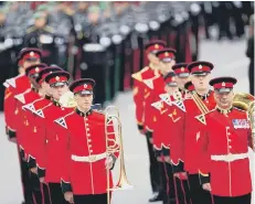  ?? ?? Members of a military marching band walking down Horse Guards Avenue.