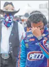  ?? John Bazemore The Associated Press ?? NASCAR Cup Series driver Bubba Wallace is overcome with emotion as he walks to his No. 43 car Monday with team owner and icon Richard Petty.