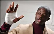  ?? AP PHOTO BY LARRY MCCORMACK ?? James Shaw Jr., shows his hand that was injured when he disarmed a shooter inside a Waffle House on Sunday, April 22, in Nashville, Tenn. A gunman stormed the Waffle House restaurant and shot several people to death before dawn, according to police,...