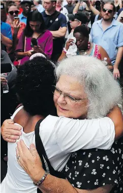  ?? —GETTY IMAGES ?? Susan Bro, right, mother of Heather Heyer, near a memorial for her daughter, who was killed one year ago during the Charlottes­ville protests.