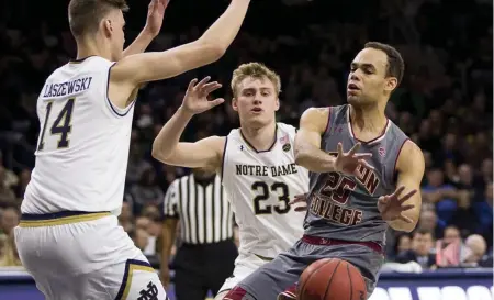  ?? ASSOCIATED PRESS ?? IN TRAFFIC: Boston College’s Jordan Chatman makes a pass during yesterday’s 69-66 loss to Notre Dame in South Bend, Ind.