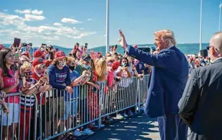  ?? Doug Mills / New York Times ?? President Donald Trump greets supporters Thursday at the Wilkes-barre Scranton Internatio­nal Airport in Avoca, Pa., before Joe Biden’s nomination acceptance speech.