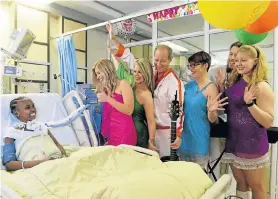  ?? Picture: FREDLIN ADRIAAN ý ‘Abba takes centre stage at Opera House’ – Page 11 ?? SPECIAL VISIT: The cast of Centrestag­e’s Abba show visits with birthday girl Ntombikazi Nkasayi in the ICU. The cast is, from left, Caron Strydom, Tara-Jane Stern, Andre Strydom, Heidi Jansen, James Smith and KerryLee Jeffery