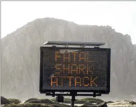  ?? SAN LUIS OBISPO TRIBUNE VIA AP ?? A sign warns beachgoers of a shark attack on Dec. 24 in Morro Bay, Calif. It was the only fatal unprovoked shark attack reported in the U.S. in 2021.