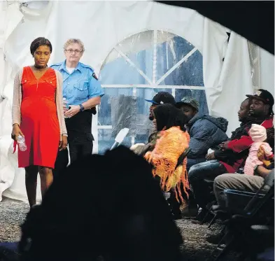  ?? GEOFF ROBINS / AFP / GETTY IMAGES FILES ?? A pregnant woman, one of the many refugees who crossed the Canada/u.s. border illegally near Hemmingfor­d, Que., last summer, walks around in a tent after being processed by the Royal Canadian Mounted Police.