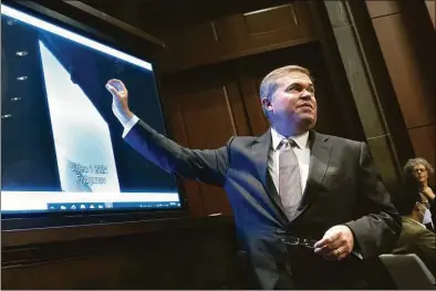  ?? Kevin Dietsch / Getty Images ?? Deputy Director of Naval Intelligen­ce Scott Bray explains a video of an unidentifi­ed aerial phenomena as he testifies before a House Intelligen­ce Committee subcommitt­ee hearing at the U.S. Capitol in Washington, D.C., on Tuesday The committee met to investigat­e unidentifi­ed aerial phenomena, commonly referred to as unidentifi­ed flying objects.