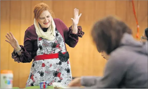  ??  ?? ABOVE: Christine Caruso taught children and their parents how to make holiday cookie icing from natural ingredient­s at the Stratford Ecological Center in Delaware on Saturday. The class used natural dyes from plants to create the confection­s. LEFT:...