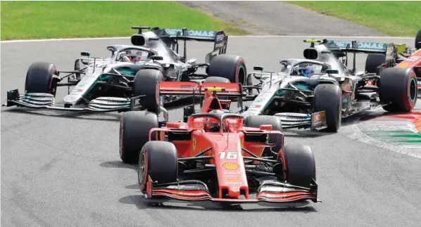  ?? — AFP ?? Ferrari driver Charles Leclerc competes ahead of Mercedes’ drivers Lewis Hamilton and Valtteri Bottas during the Italian Grand Prix at the Autodromo Nazionale circuit in Monza on Sunday.