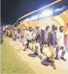  ?? — Bernama photo ?? Air-con buses used to ferry illegal immigrants from the Papar Immigratio­n Detention Depot to the Sandakan Port.