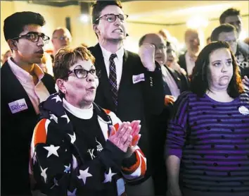  ?? Rebecca Droke/Post-Gazette ?? Supporters of State Rep. Rick Saccone are astonished by the tight race as returns come in at an election night party Tuesday at the Youghioghe­ny Country Club in Elizabeth Township.