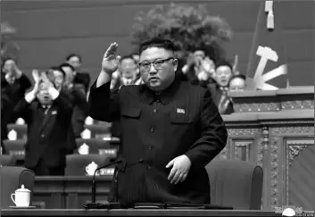 ?? Tral News Agency/Korea News Service via AP
Korean Cen- ?? In this photo provided by the North Korean government, North Korean leader Kim Jong Un acknowledg­es to the applauds after he made his closing remarks at a ruling party congress in Pyongyang, North Korea on Tuesday.