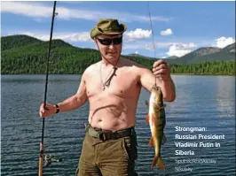  ?? Sputnik/AFP/Alexey Nikolsky ?? Strongman: Russian President Vladimir Putin in Siberia