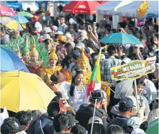  ??  ?? LEFT
Ghosts from Myanmar are accompanie­d by traditiona­l dancers as they slowly move through the crowds.