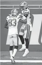  ?? GETTY IMAGES ?? The Packers’ Robert Tonyan is joined by Marquez Valdes-Scantling in celebratin­g his fourth-quarter touchdown.