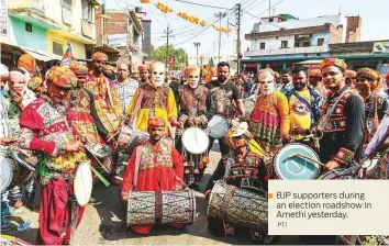  ?? PTI ?? BJP supporters during an election roadshow in Amethi yesterday.