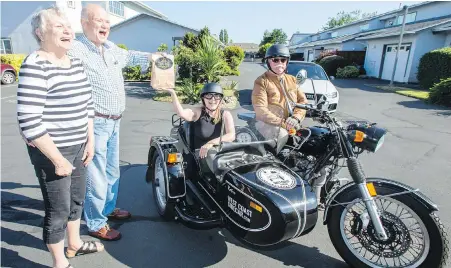  ?? DARREN STONE, TIMES COLONIST ?? Cindy Pendergast of Truth and Alibi Cannabis and David Cameron of West Coast Sidecar make the first legal delivery of CBD cream to Dick and Skip Angus in Sidney on Thursday.