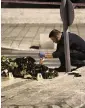  ?? MAHMOUD ILLEAN AP ?? An Israeli policeman examines the body of a Palestinia­n man shot near Damascus Gate to the Old City of Jerusalem, on Saturday, after an ultra-Orthodox Jewish man was stabbed nearby.