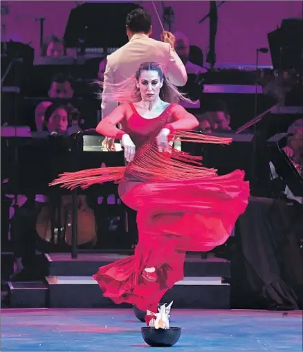  ?? Wally Skalij Los Angeles Times ?? SIUDY GARRIDO performs Falla’s “El Amor Brujo” with her Siudy Flamenco Dance Theater on Thursday at the Hollywood Bowl.
