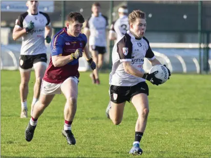  ??  ?? Timmy Govorov of IT Sligo in action with University of Limerick’s Plunkett Maxwell in IT Sligo on Sunday. Pic: Donal Hackett.